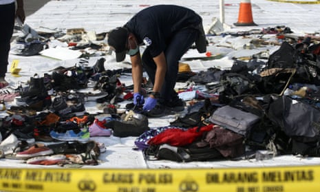 An investigator inspects debris from Lion Air flight JT 610 that crashed into the Java sea on Monday.