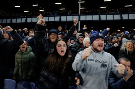 Home fans in the Gwladys Street End celebrate after Everton’s first goal against Liverpool