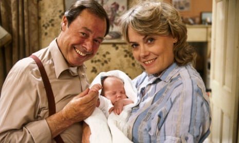 Bill Treacher and Wendy Richard as Arthur and Pauline Fowler, with baby Martin, in EastEnders, 1985.