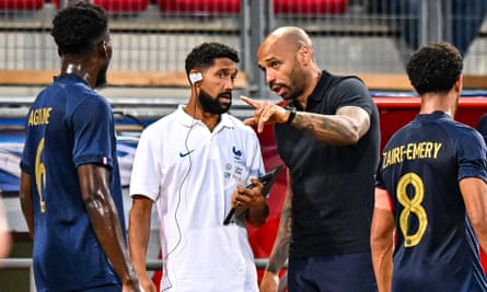 Clichy working with Thierry Henry for the France Under 21s.