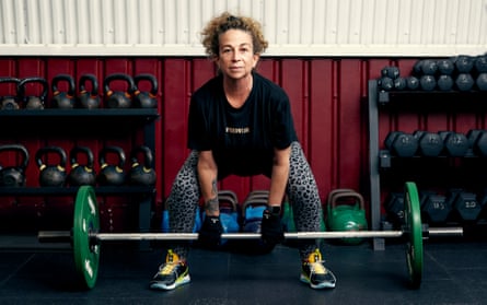 Writer Monique Roffey lifting weights at a women-only gym in London