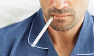 Man with thermometer in mouth