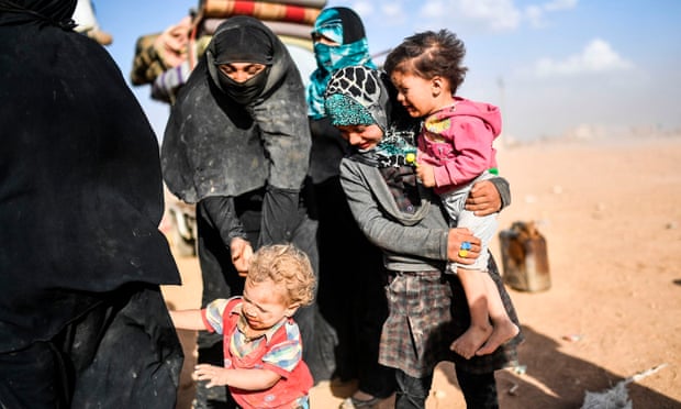 Displaced Syrians on the outskirts of Raqqa this week after fleeing the city of Deir ez-Zor.