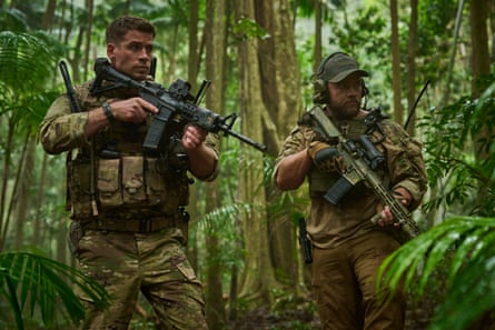 The brothers dressed as soldiers in a jungle