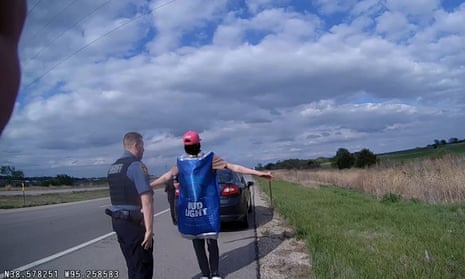 A photo released by the Franklin county sheriff's office from the 5 May arrest shows the driver clad in a red baseball cap and Bud Light costume while doing field sobriety tests.