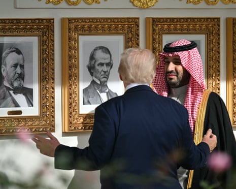 Trump and MBS speak as they walk.