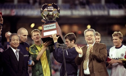 Dennis Irwin, Teddy Sheringham and Jaap Stam lift the trophy after Manchester United did the double over Australia.