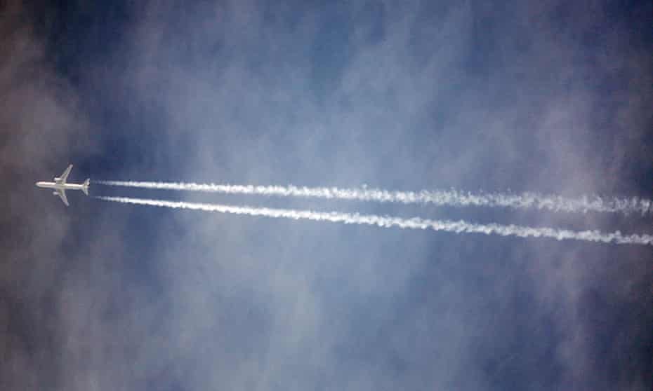 A plane in flight over Stansted Airport, in Essex, UK.