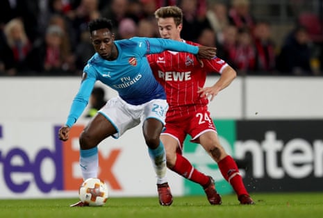 Lukas Kluenter (R) in action with Arsenal’s Danny Welbeck.
