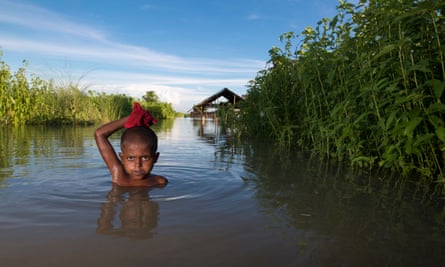 A child in the flood-affected area of Lalmonirhat, Bangladesh, in 2017. What we’re deciding now is what life will be like for the kids born this year who will be 82 in the year 2100.