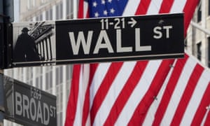 The Wall Street sign is pictured at the New York Stock exchange in Manhattan.