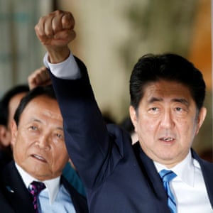 Japan’s PM Shinzō Abe raises his fist after calling a snap election.