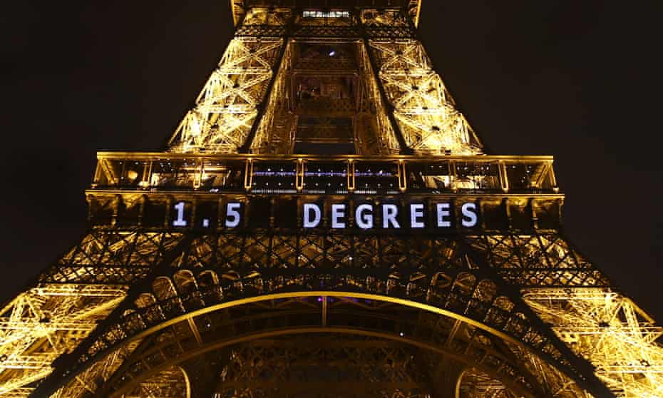 The Eiffel tower lit up during the Paris climate talks, referencing the 1.5C target that governments have agreed to pursue efforts to hold temperatures to