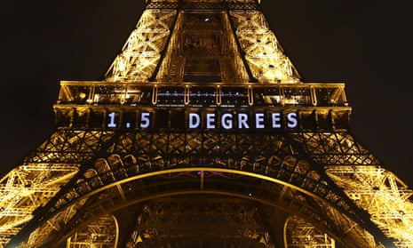 The slogan ‘1.5 degrees’ is projected on the Eiffel Tower during the Paris climate summit