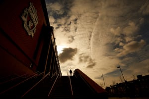 19 March – A visitor taking photographs outside Liverpool FC’s Anfield stadium where the team were due to play Crystal Palace
