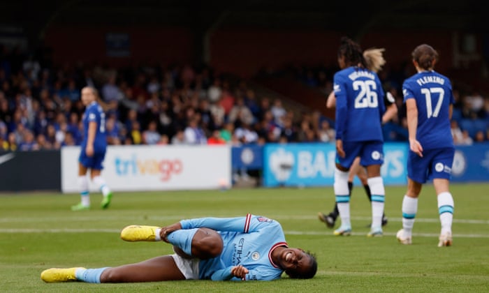 Khadija Shaw goes down.