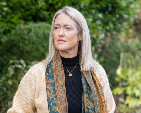 Esther Ghey, wearing a jumper and scarf, looks to one side