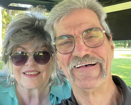 two smiling people in glasses