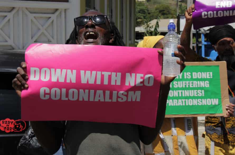 Protesters in Kingstown greet the Royal couple.