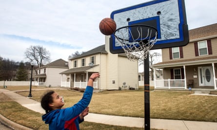 Mya Womack shoots baskets outside her home in the Spring Grove subdivision.