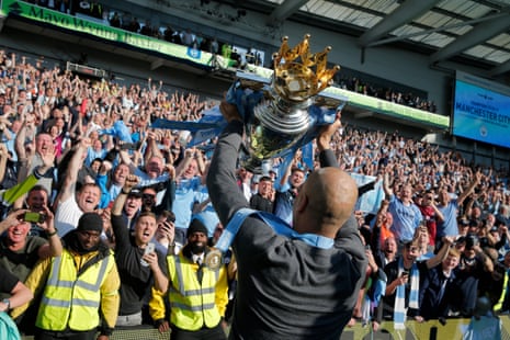 Pep Guardiola lifts the Premier League at Brighton in 2019