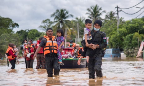Residents being evacuated from a district on the outskirts of Kuala Lumpur.