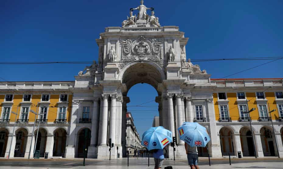 Tour guides await customers in Lisbon, Portugal