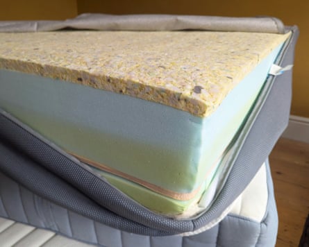 The corner of a Simba Hybrid Pro, with cover unzipped revealing the layers of construction.