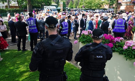 Police watch as spectators arrive at Royal Ascot.
