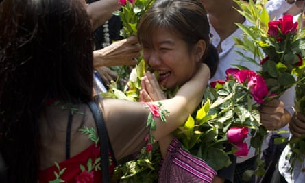 Family members welcome a student protester as she arrives for the hearing in Tharrawaddy.