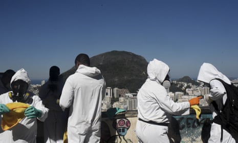 Sanitary staff prepare to disinfect against coronavirus in the Santa Marta Favela near Rio de Janeiro, Brazil.