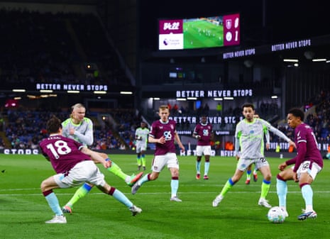 Erling Haaland hits the post for City.