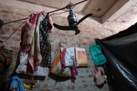 The makeshift tent where Kumkumari, 35, lives with her family, seen from inside. Built of plastic with no ventilation, it relies on a small temporary fan for cooling. A contract labourer from Bihar with a decade in the trade, she has worked here for a few months and recently battled heat stress for over a week.