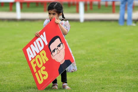 A child holding an 'Andy for Us' placard at the event.