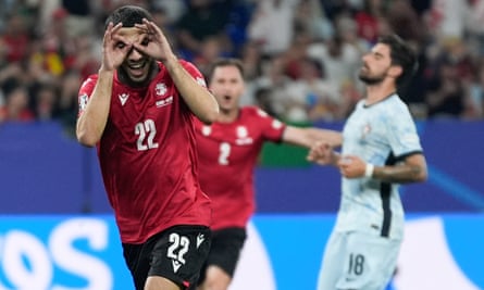 Georgia's Georges Mikautadze celebrates scoring his penalty against Portugal