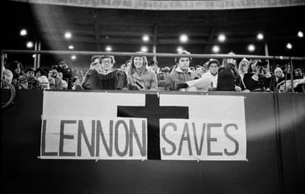 Image of fans in the audience holding a sign saying ‘Lennon Saves’ in front of their stand