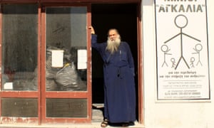 Father Stratis Dimou, a Greek Orthodox priest on the island of Lesbos, at the charity he founded to help refugees and migrants.