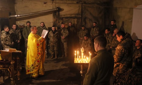 Chaplain Ivan of the Orthodox church of Ukraine reads a prayer for Ukrainian servicemen.