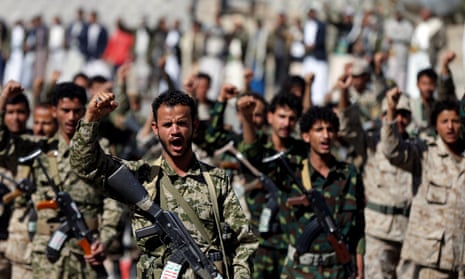 Houthi militants march in Sanaa, Yemen.