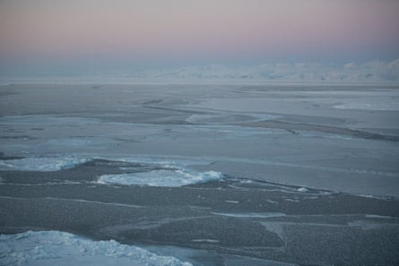 The waters of Eclipse Sound solidify into sea ice in Pond Inlet, Nunavut, Canada.