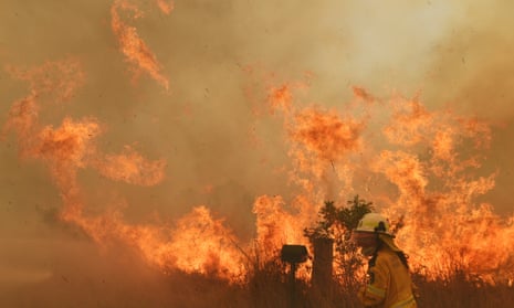 A firefighter battles a bushfire in New South Wales
