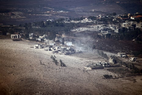 Dusty air sweeping across a hillside town.