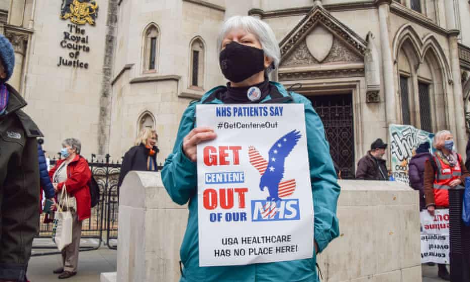 Protesters gather outside the Royal Courts of Justice as the legal challenge began against the takeover of London GP practices by US company Centene. 
