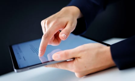 hands tap a tablet