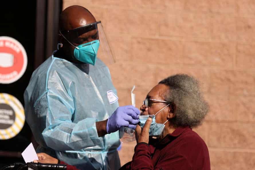 A nurse administers a coronavirus test at the Los Angeles Mission homeless shelter.