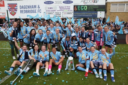 Manchester City players celebrate with the trophy after winning the Women’s Super League