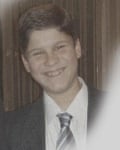 Patrick Dabbagh as schoolboy, smiling