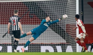 Martin Dubravka paws away the ball.