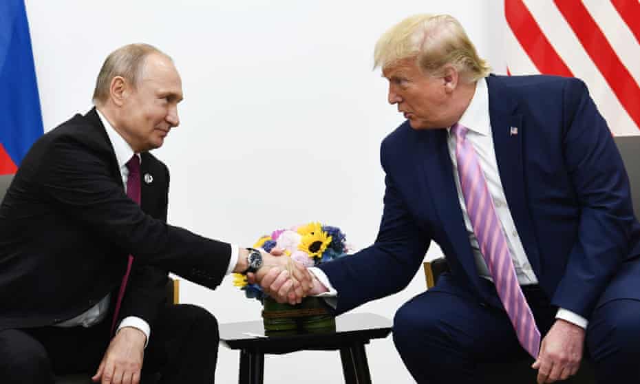Trump with Putin in Osaka in June last year. Trump has continued his obsequious behavior towards the Russian president.