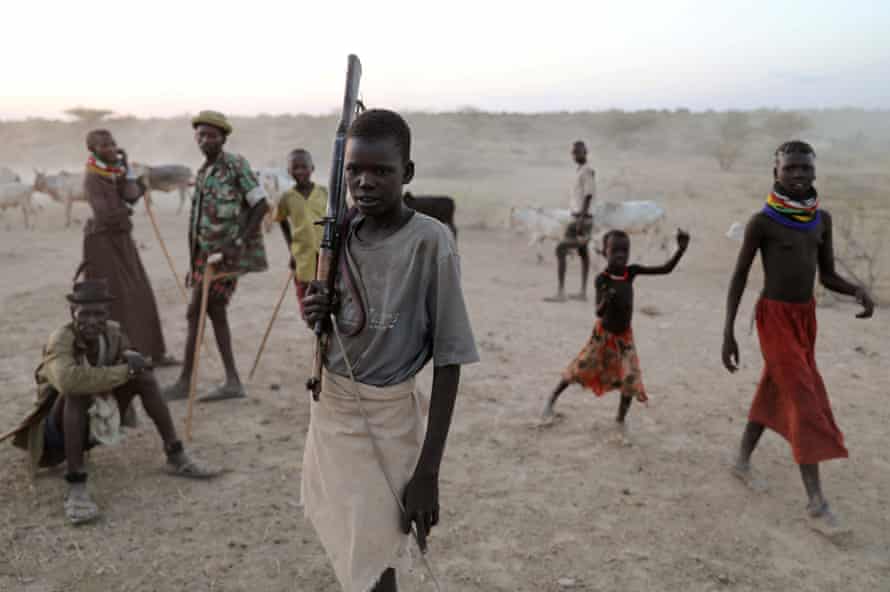 A young Turkana warrior arrives with cattle to a settlement in Ilemi Triangle, Kenya.